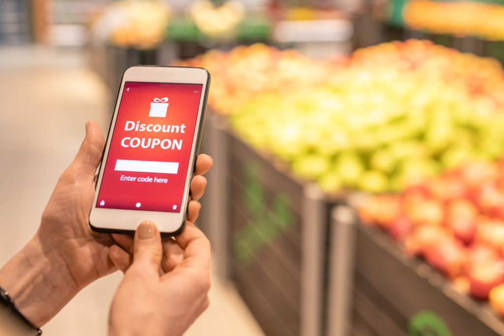 female on a phone getting a coupon